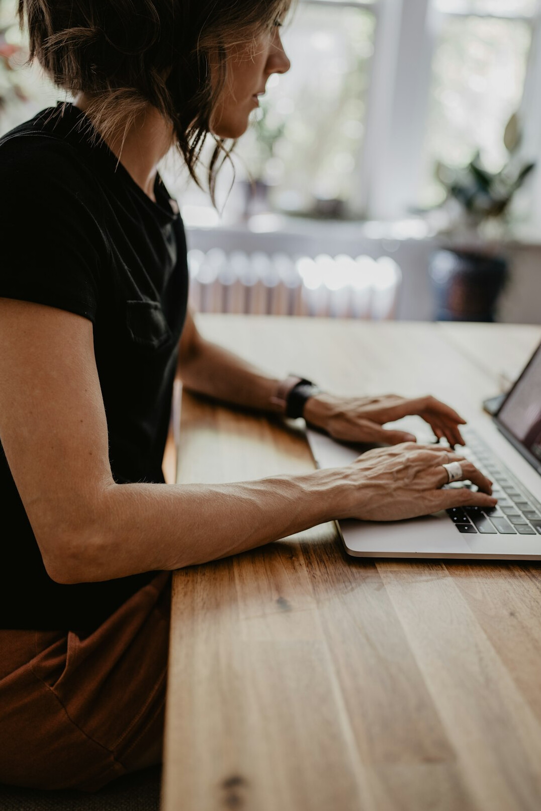 woman studying with laptop at desk