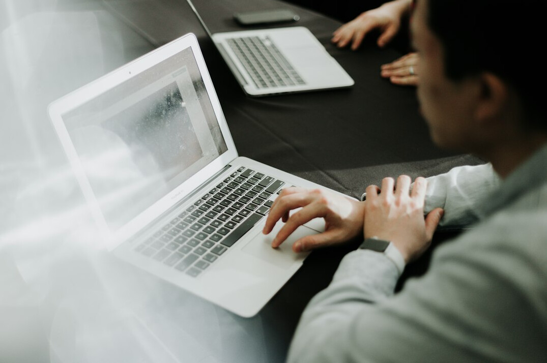 person taking online course on laptop